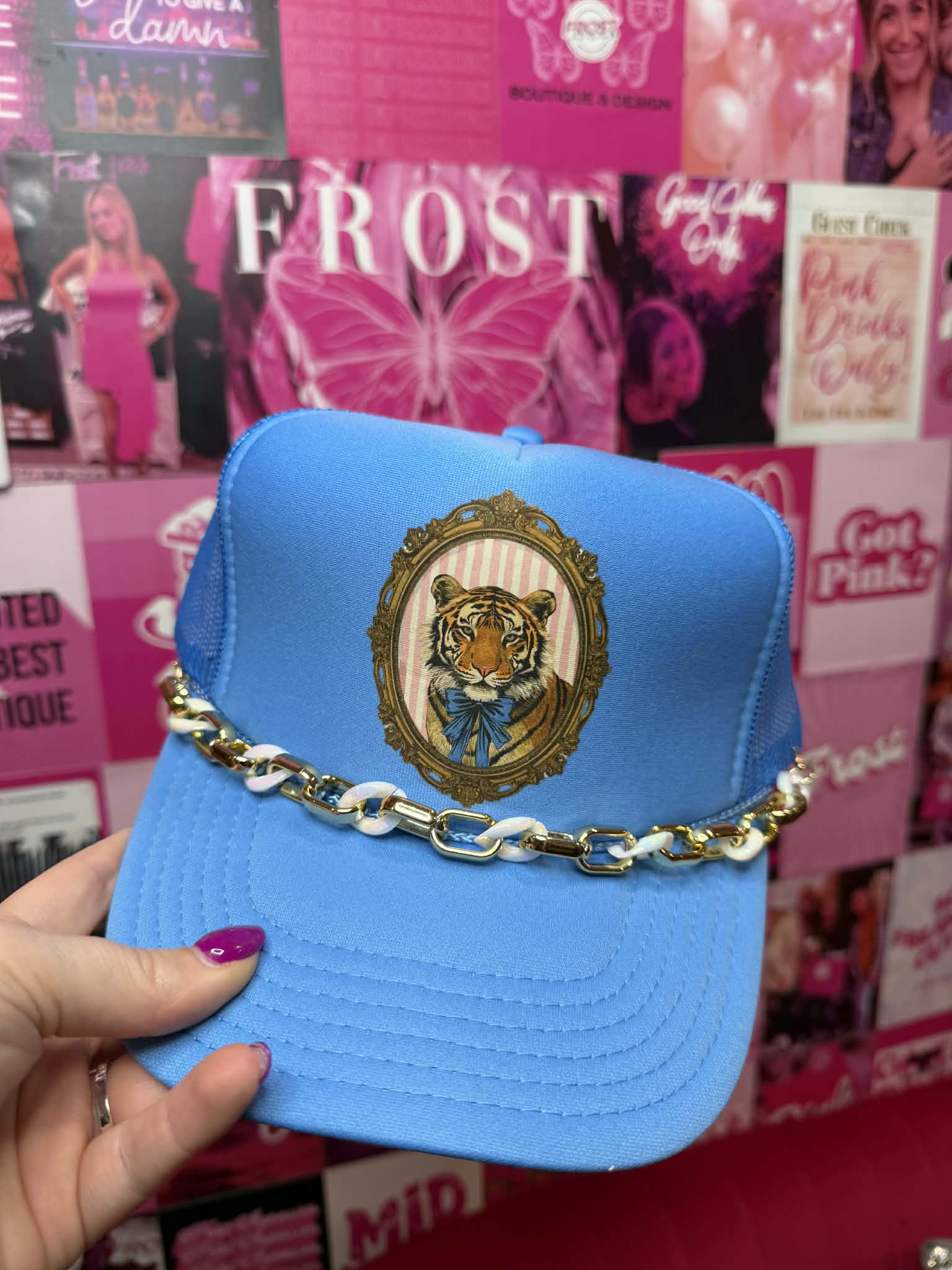 Blue trucker hat with tiger graphic design and breathable mesh back