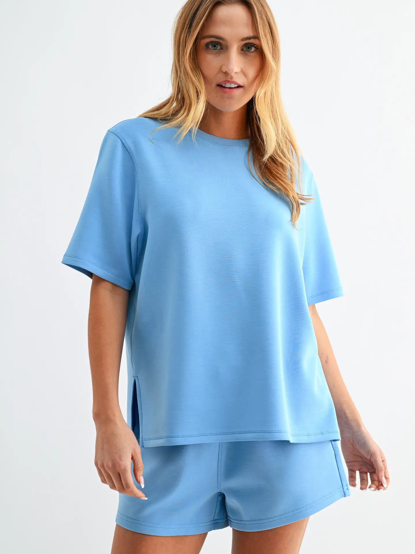 Butter soft scuba tee set with short sleeve top and matching shorts featuring elastic waistband and pockets in a relaxed fit