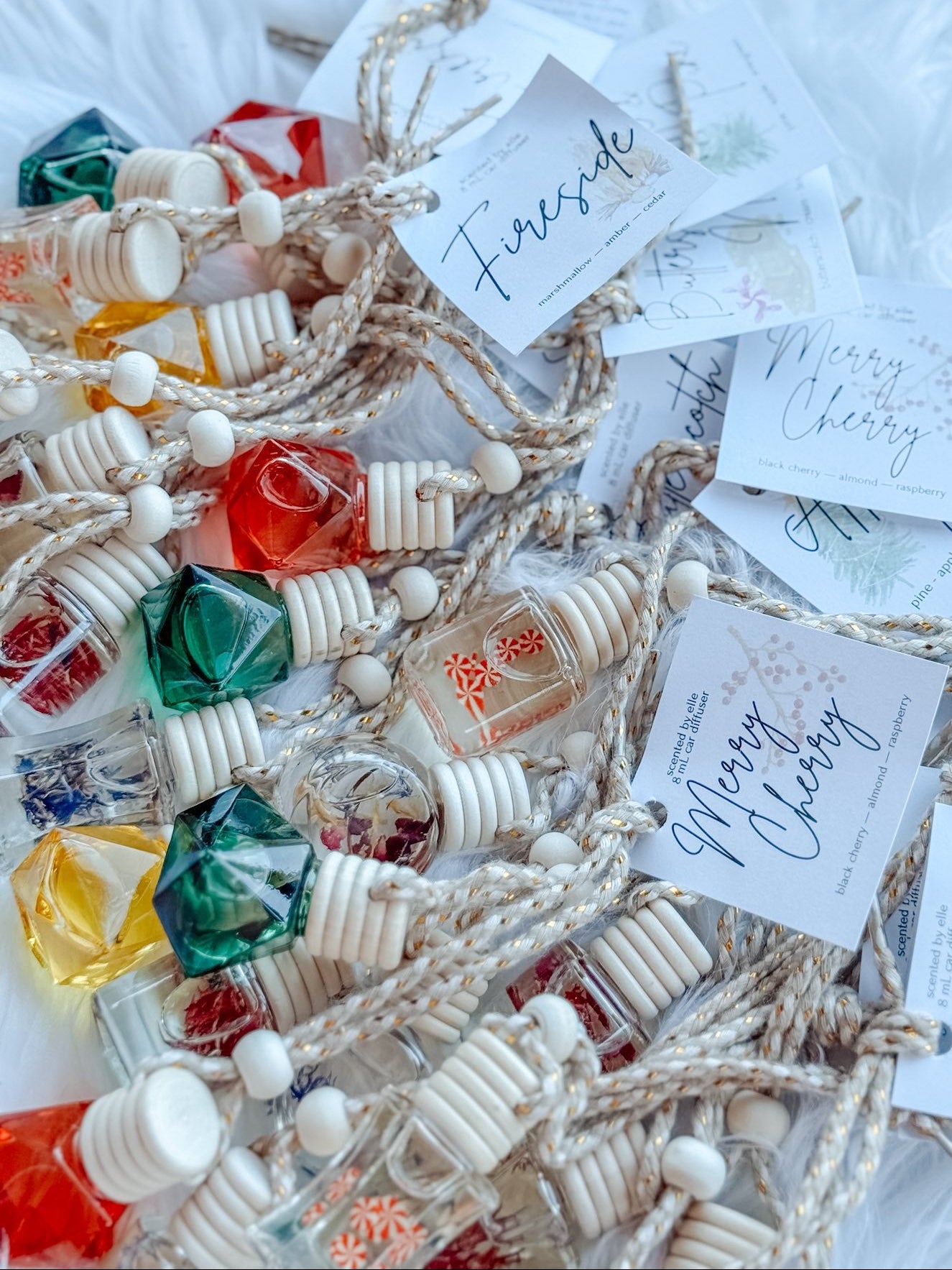 Car Diffusers from Frost Impressions Boutique — hanging glass bottle air fresheners in assorted scents, available in Wapakoneta, Ohio.