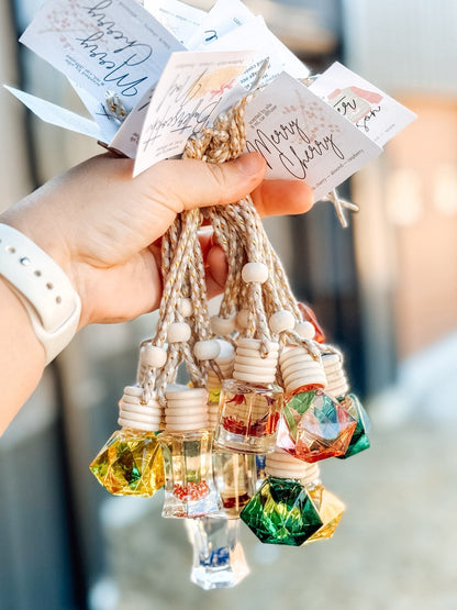 Car Diffusers from Frost Impressions Boutique — hanging glass bottle air fresheners in assorted scents, available in Wapakoneta, Ohio.