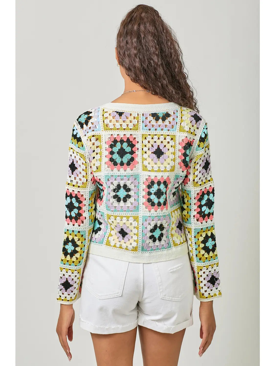 Multicolor crochet button-up cardigan with V-neckline, loose fit, and boho knit texture