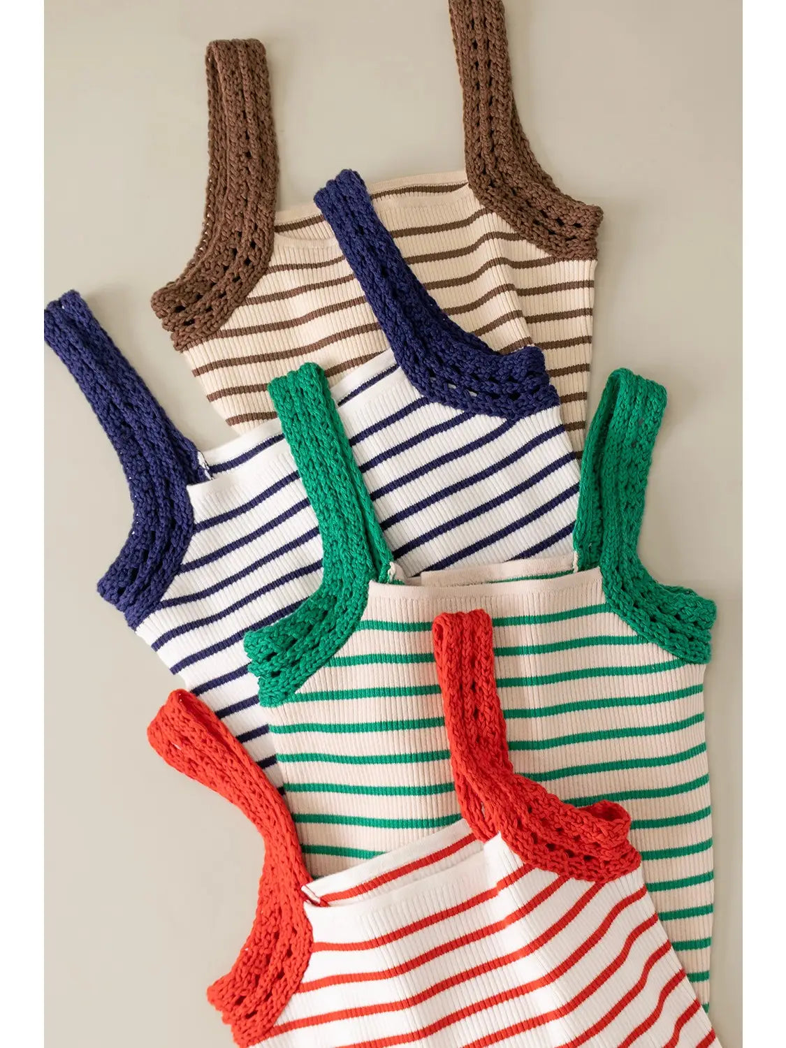 Striped knit tank top with crochet sleeve detail in fitted silhouette available in multiple colors
