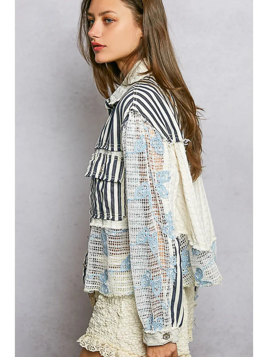 Blue patchwork long sleeve woven jacket with cable knit and lace floral details, button front, and relaxed fit