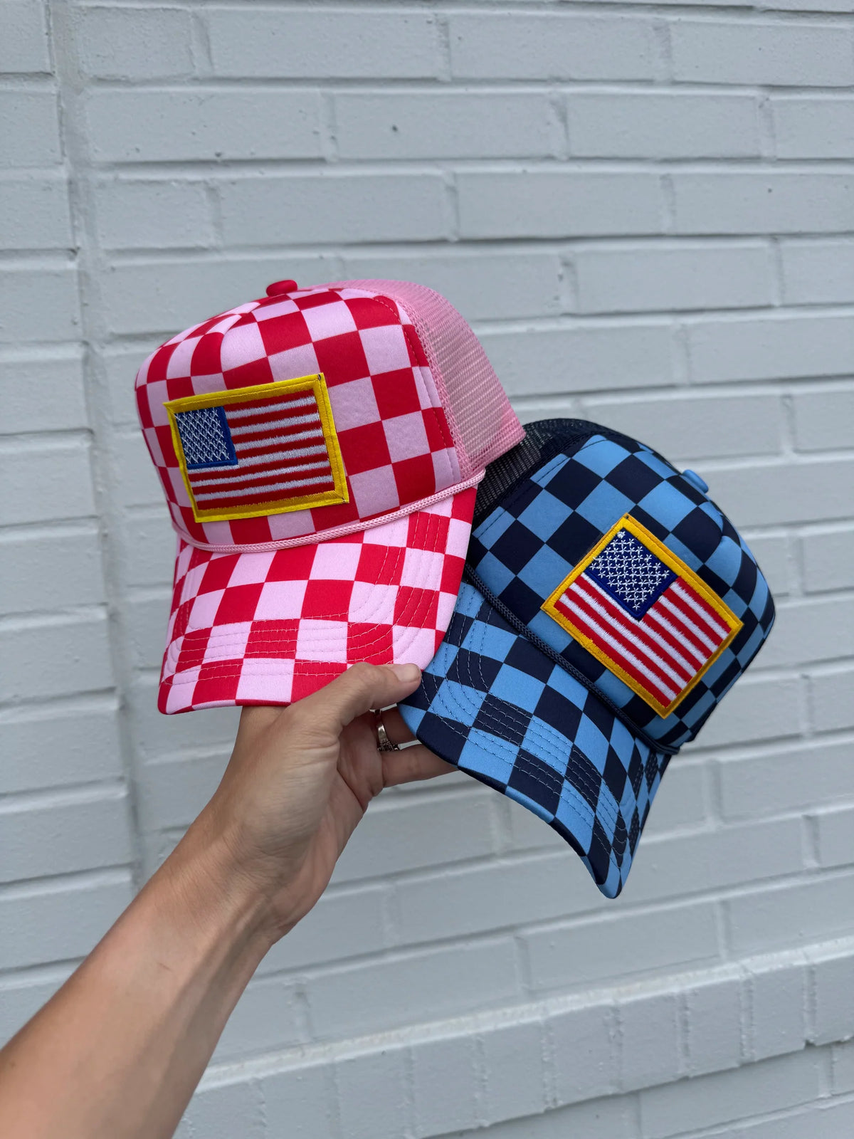 Checkered flag pattern trucker hat with mesh back and adjustable snap closure