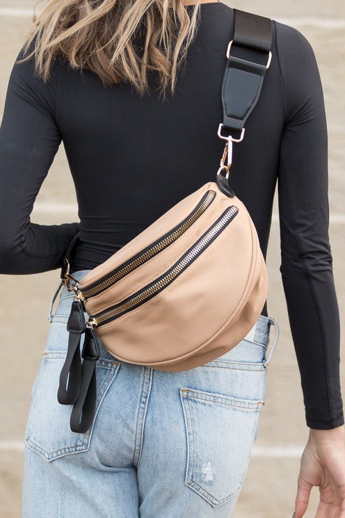 Gia Sling (Almond) — tan nylon crossbody sling bag with gold hardware and vegan leather accents, available at Frost Impressions Boutique in Wapakoneta, Ohio.