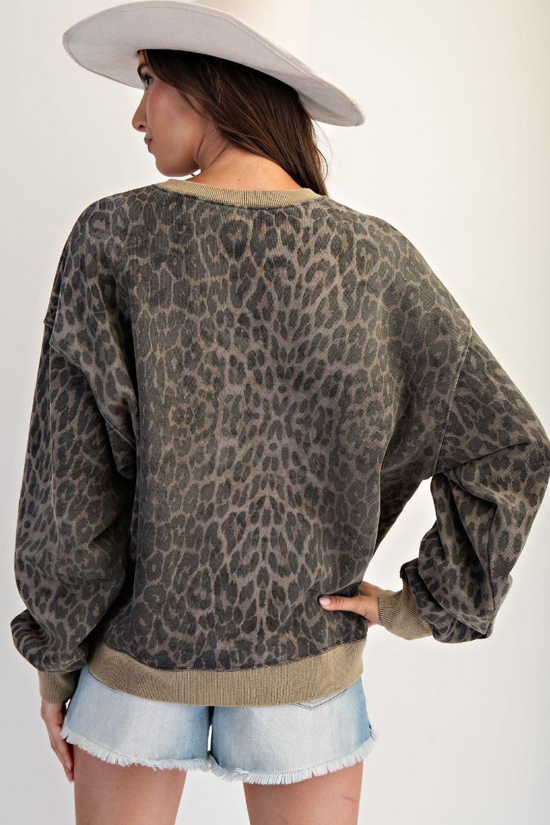 Wild at Heart leopard print mineral washed terry pullover with red “ROCK” heart graphic, oversized fit, and crew neckline.