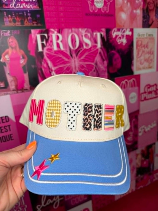 Trucker hat with MOTHER patchwork graphic design, mesh back, and casual everyday style