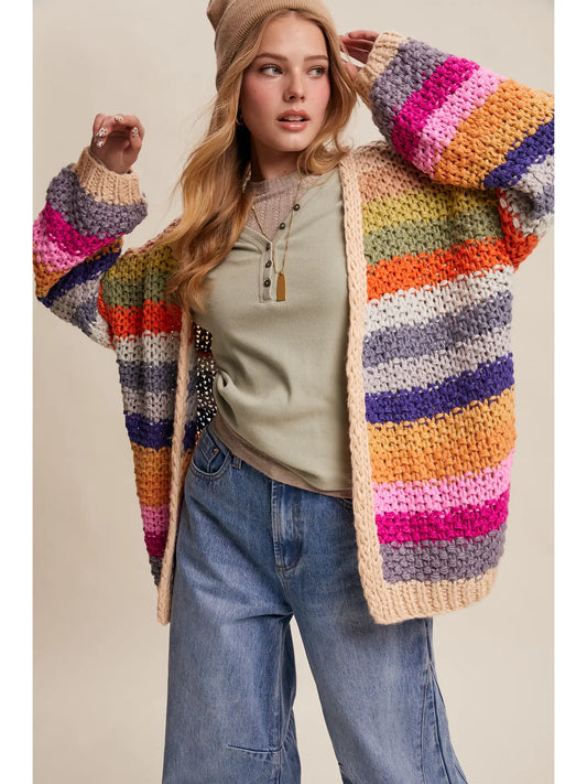 Rainbow multi crochet cardigan with chunky knit texture, balloon sleeves, and side pockets from Frost Impressions Boutique.