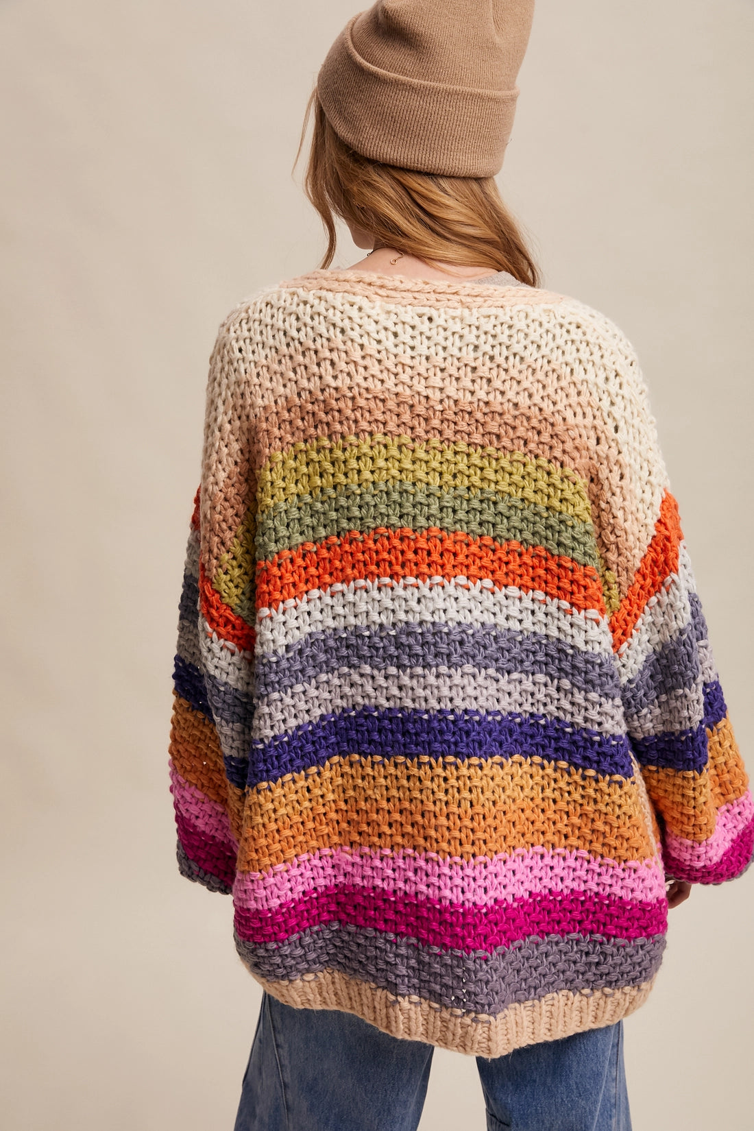 Rainbow multi crochet cardigan with chunky knit texture, balloon sleeves, and side pockets from Frost Impressions Boutique.