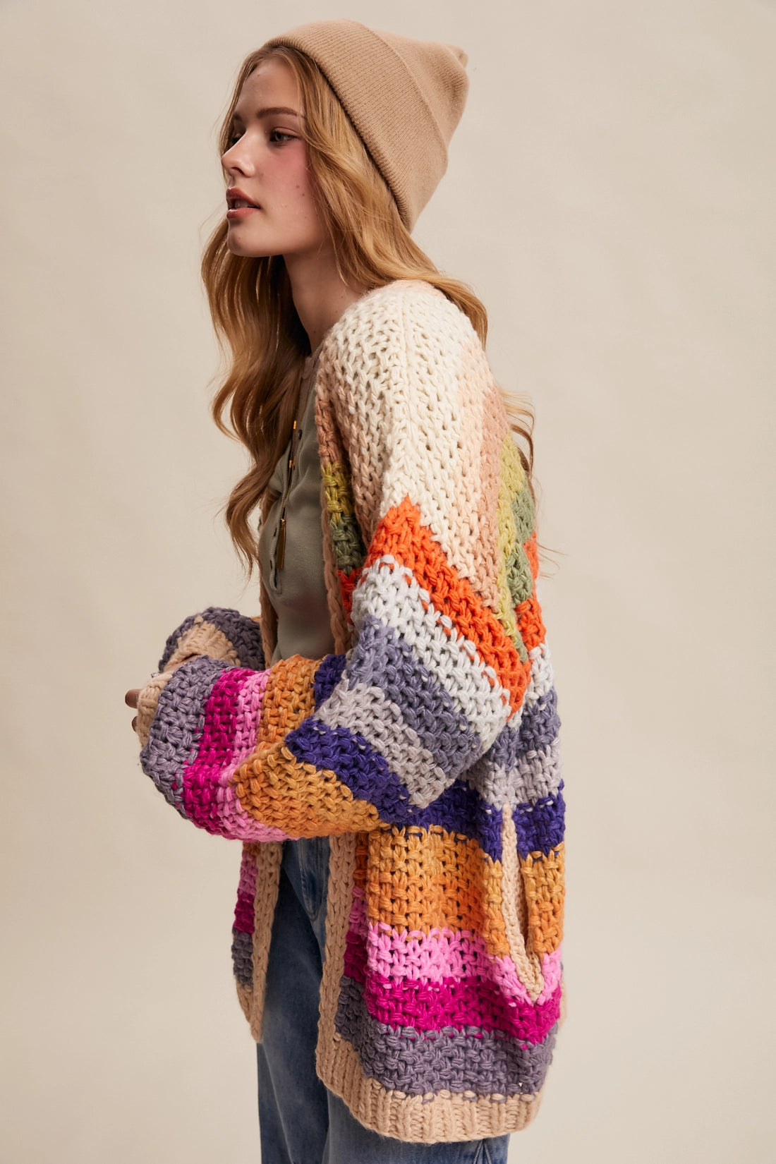 Rainbow multi crochet cardigan with chunky knit texture, balloon sleeves, and side pockets from Frost Impressions Boutique.