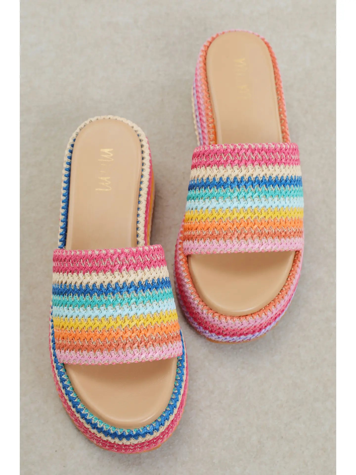 Colorful platform sandals with textured rainbow design and cushioned sole for everyday summer wear