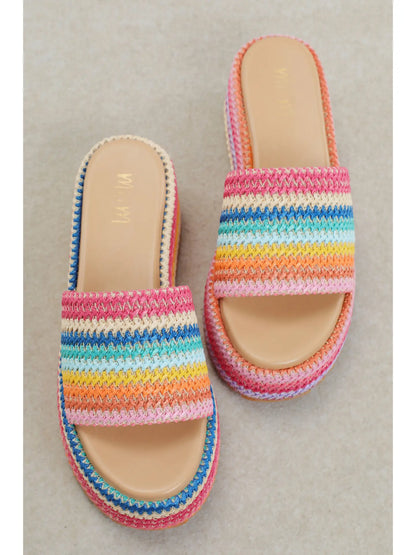 Colorful platform sandals with textured rainbow design and cushioned sole for everyday summer wear