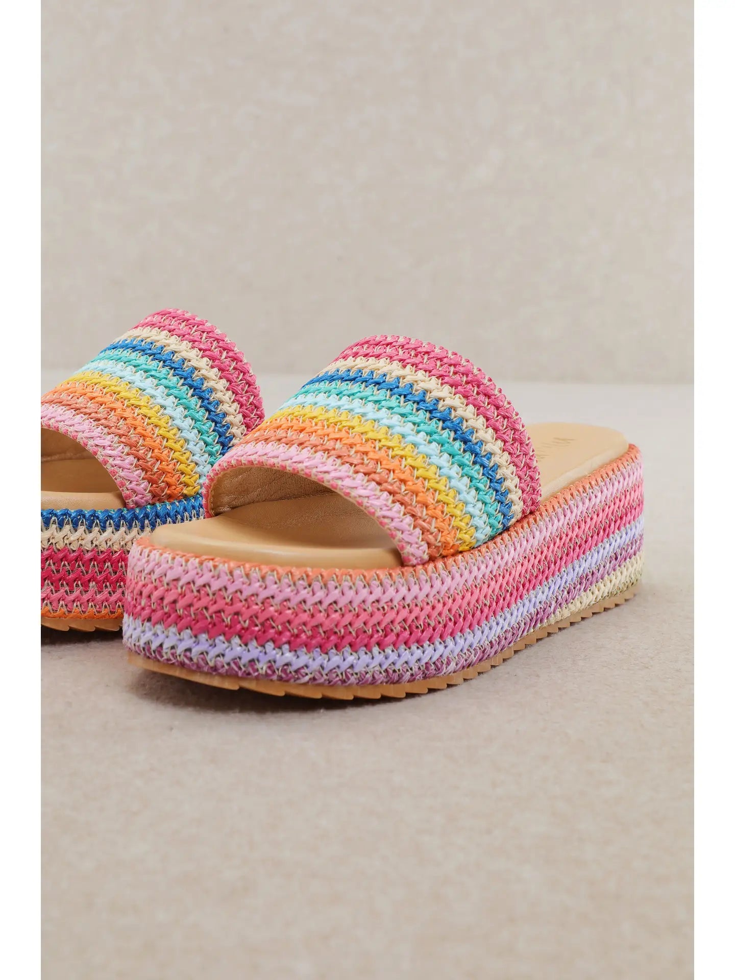 Colorful platform sandals with textured rainbow design and cushioned sole for everyday summer wear