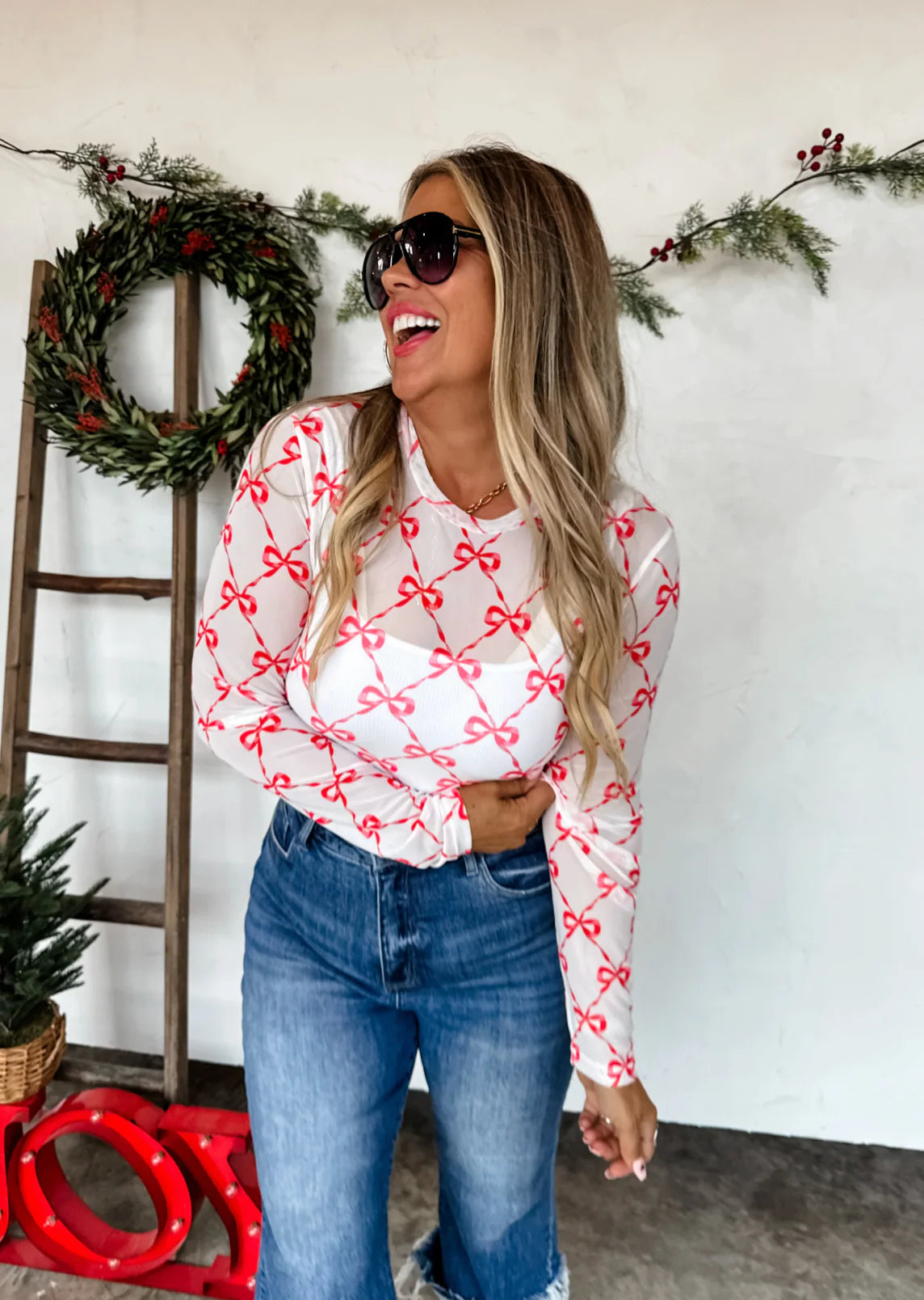 Red Bows sheer holiday mesh long sleeve top with thumbholes — Frost Impressions Boutique, Wapakoneta, Ohio.