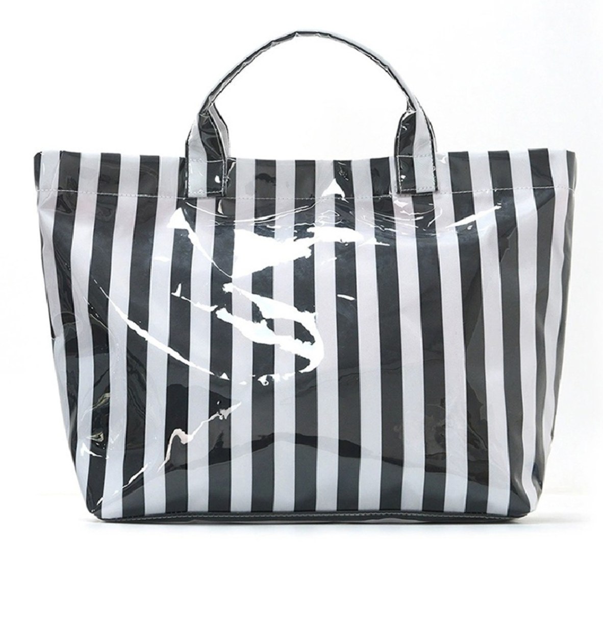 Black and white striped PVC tote bag with large capacity, waterproof finish, and zipper pocket