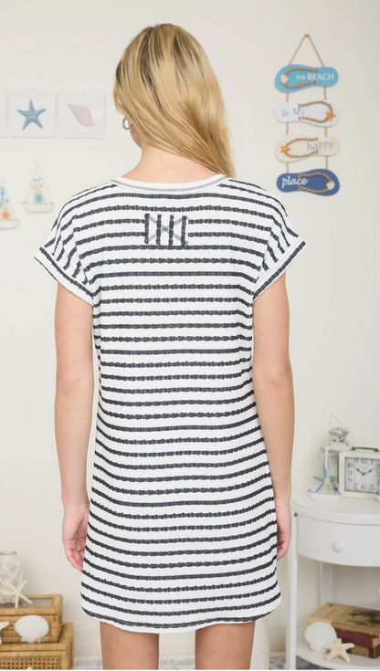 Black textured knit t-shirt mini dress with cuffed sleeves, pocket detail, and relaxed fit