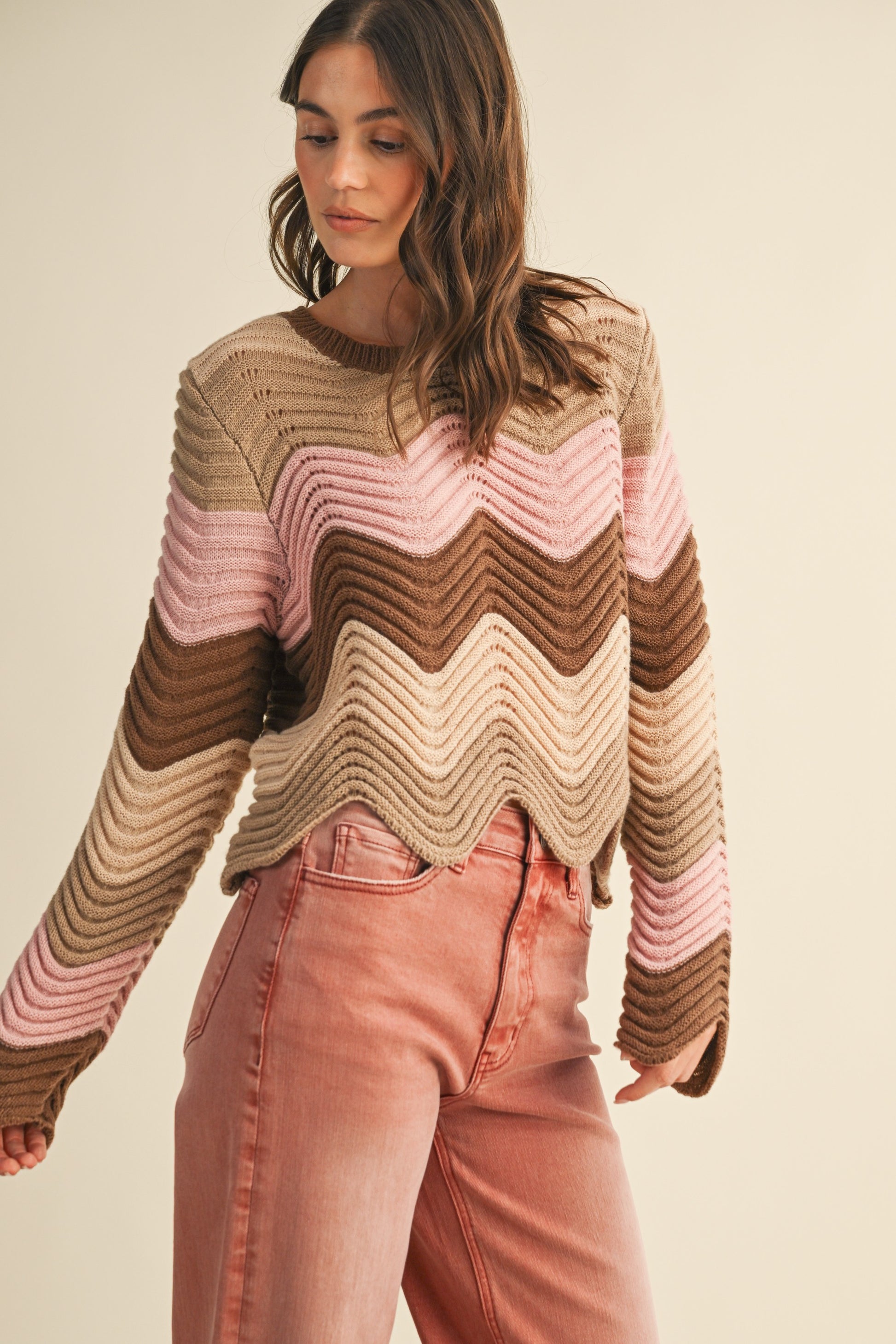 Coastal Wave Sweater Top with multicolor wave pattern, pointelle knit texture, long sleeves, round neck, and cropped length.